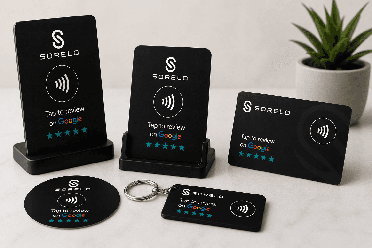 The four Sorelo Review Kit items: stand, card, sticker and keychain, each printed with a tap-to-review-on-Google prompt
